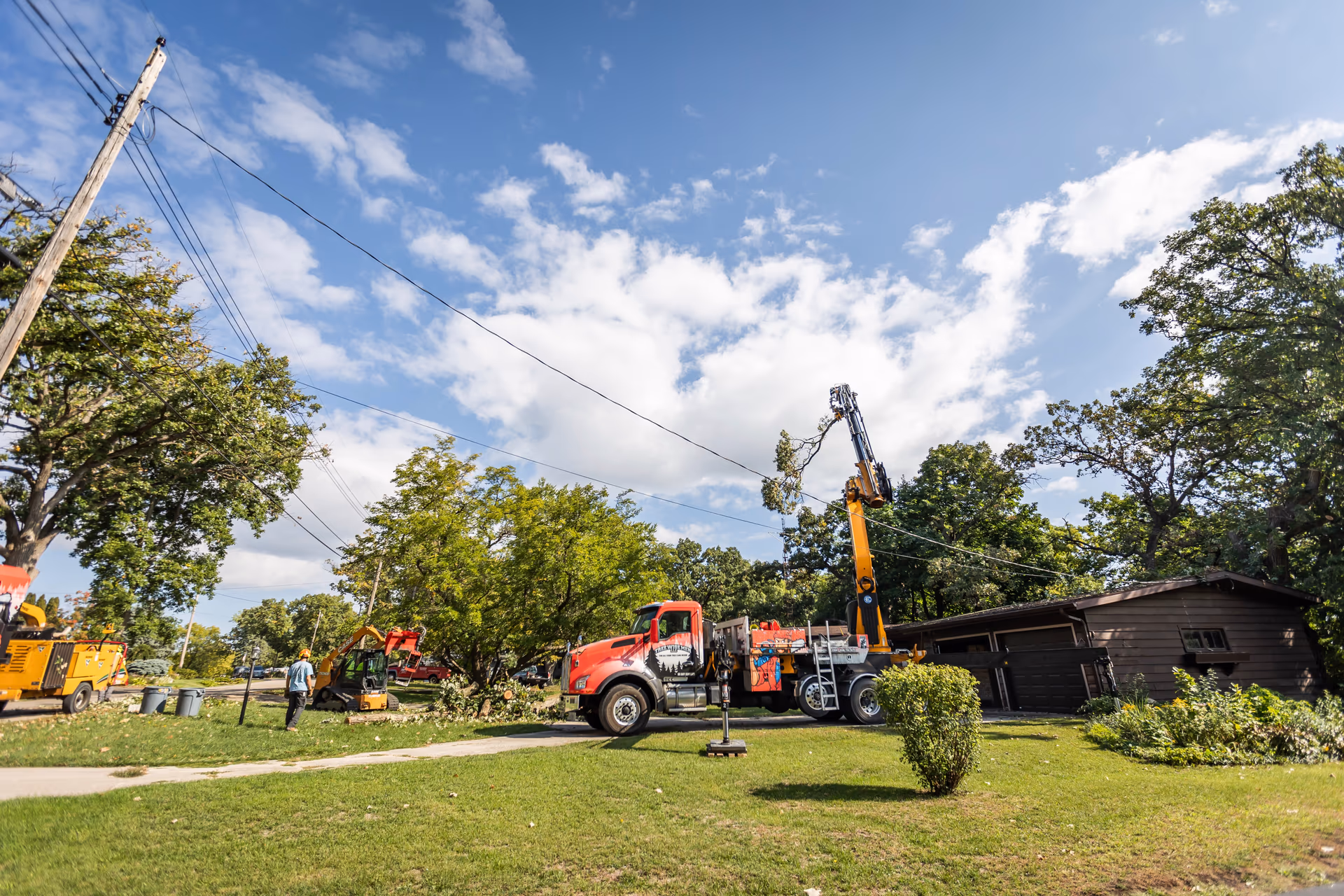 Crane Boom Extended Over the Neighborhood Canopy
