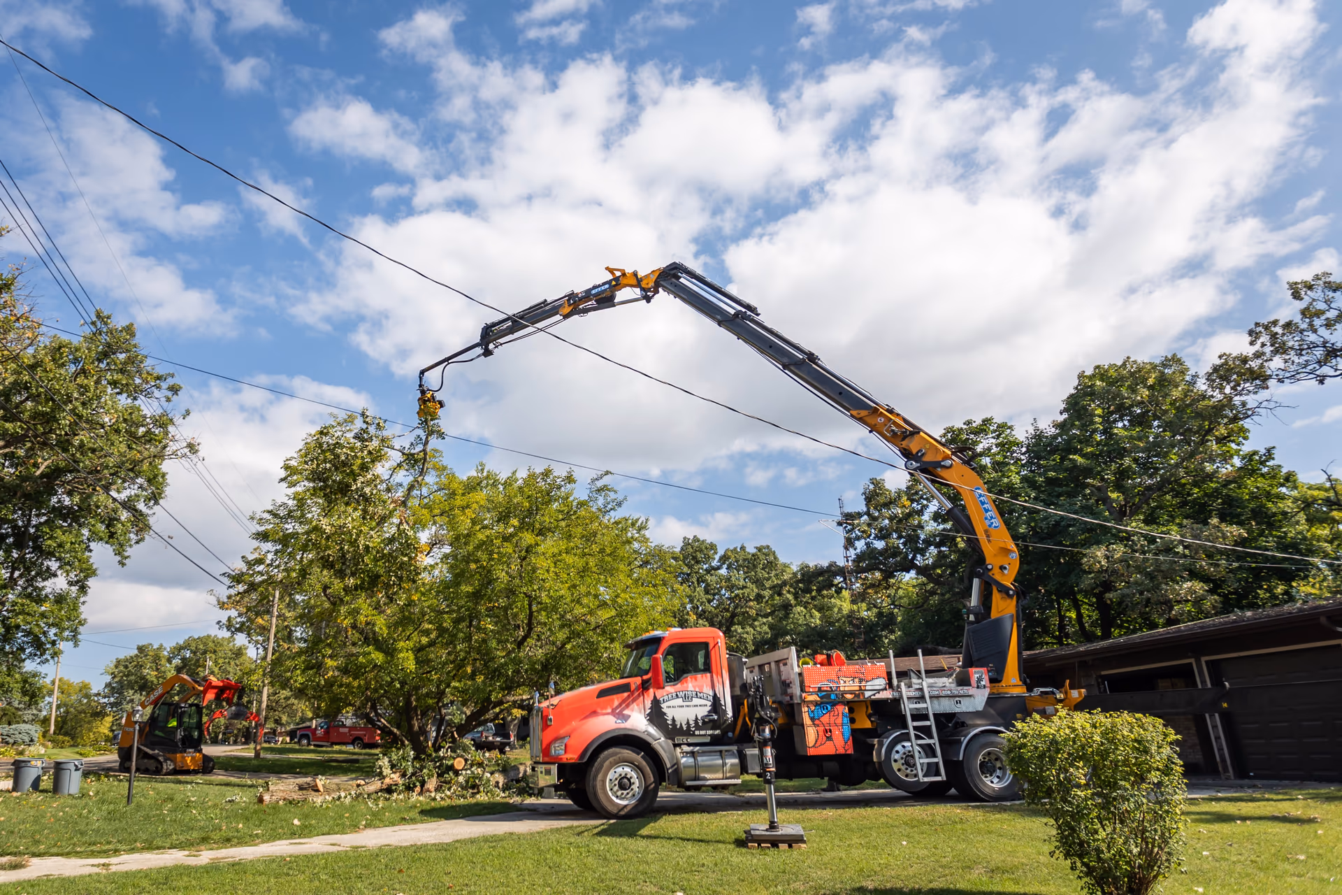 Crane Truck Set Up on a Residential Lawn