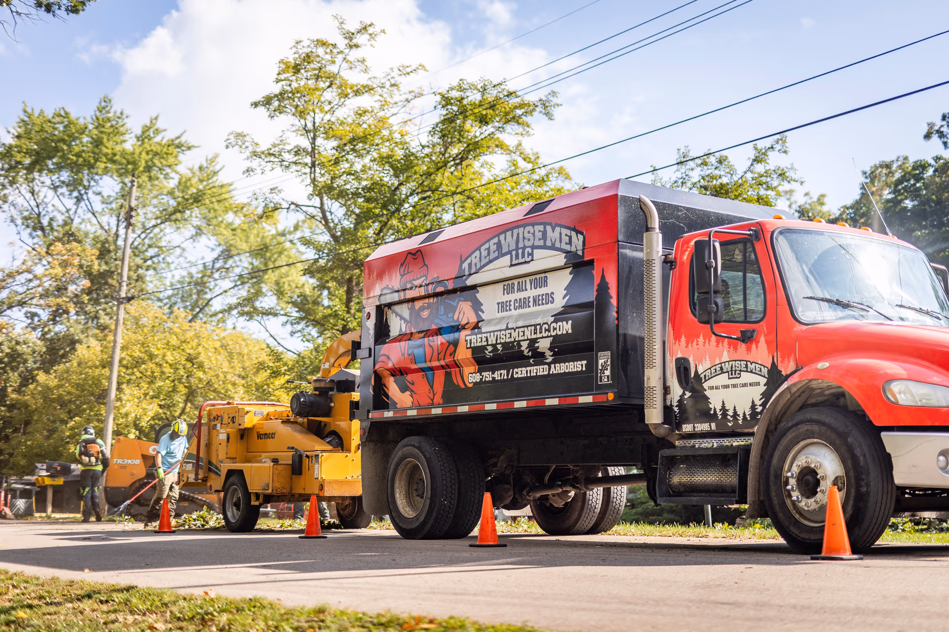 Tree Wise Men branded truck and crew on a job site in Southern Wisconsin